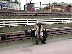 Chubby girl masturbates ina public bench beside a busy road