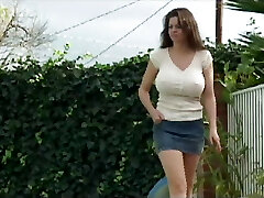 This ever horny MILF tempts a guy with a big hard cock and