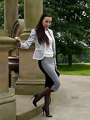 Super-sexy dark haired Sophia gets out the office to walk and tease outdoors in nylon stocking and high stiletto heels