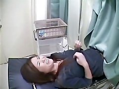 A fresh woman is investigated on the gynecological table in this hot medical voyeur video