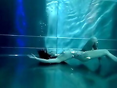 Bond Damsel, underwater stunts, nerd girl, high heels glamor and underwater swimming retro style 