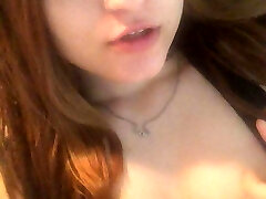 Redhead Asian masturbates her cunt with thumbs and cums