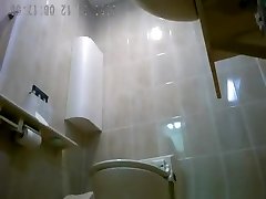 Asiatic femmes spied in public rest room peeing