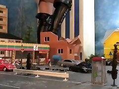 beautiful giantess stomping city in high heels and boots