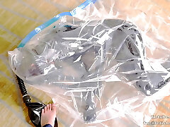 Cute Spandex girl on vacuum bag and mask, breathplay