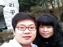 Amateur Korean couple bangs in classic missionary position on camera