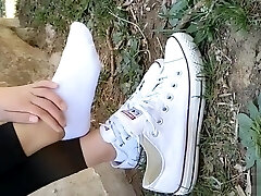 Japanese girl sprains foot in white ankle socks and ebony leggings