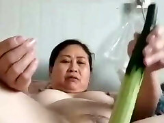 mature plump Chinese woman with veggie