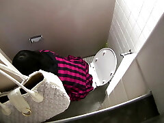 A woman who is bold and enticing in a closed apartment.