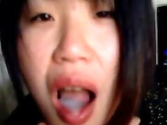 Asian babe jerking and sucking