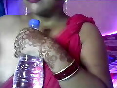 Hot desi sexy woman opens her clothes and displays her boobs and nipples. Hot desi sexy woman opens her clothes and displays her boobs and nipples.