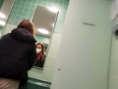 In the public rest room at a motorway service station