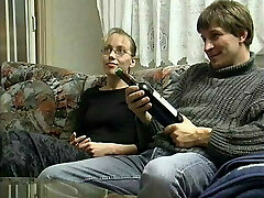 Young Couple in the 90s smashed on the Couch