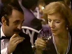 Dark-haired Brie in a movie providing service to all the high society