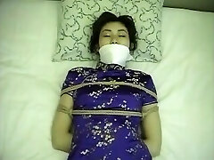 Chinese dress gal tied up and gagged