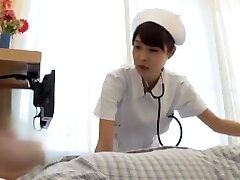 Slutty Japanese nurse receives a cumshot after sucking a fuckpole
