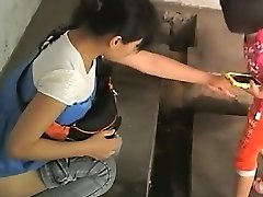 Asian chicks in an old public toilet