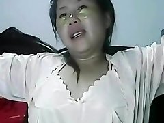 Dousing pussy of lonely Chinese MILF