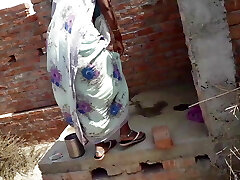 Beautiful Indian bhabhi urinating on her house roof and finger-banging her cremei tight pussy