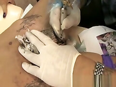 Tabitha gets a tat in her pussy
