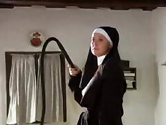 Slave girl is trussed up and lashed by a sexy nun
