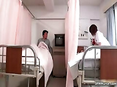 Marvelous Asian nurse gives a patient some part3