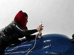 Domina wearing Spandex torturing trapped Slave in Rubber Vacuum Bed VacBed