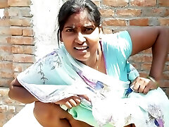 Handsome Indian bhabhi pissing on her house roof and fingering her cremei taut pussy