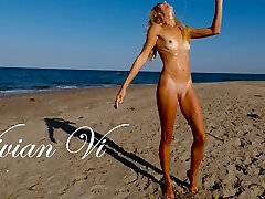 Naked Workout on the beach - a handsome skinny milf with diminutive tits