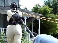 condom doll jewell in TIGHT corset and white catsuit