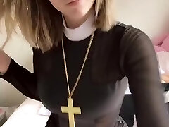 Pious girl with a cross shows her cupcakes and pussy