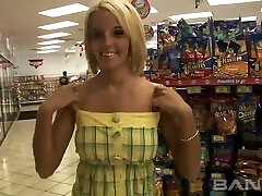 Cute blond haired chick shows her pierced slit in the shop