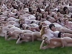 5000 nude people laying out for the cameraman who makes books