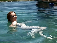 Ginger-haired teen babe Katy Kiss sucks and nails by the pool outdoors