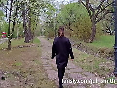 Hot girl in a very short dress walks in the park and demonstrates her pussy