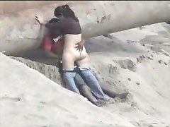 Latino couple caught on the beach