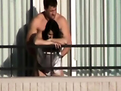 couple penetrates on hotel balcony