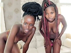 Two African girls draining