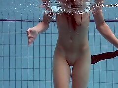 Pretty swimming stunner Liza Rachinska shows striptease under the water
