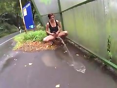 sexy girl power pissing public flashing at bus stop