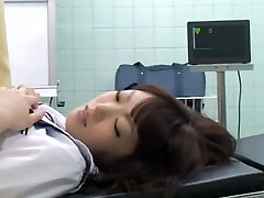Noisy oriental schoolgirl getting fingered by her doctor on the medical bed