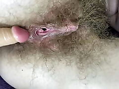 Hairy doll plows her wet big clit pussy with dildo in close up Hairy doll plows her wet big clit pussy with dildo in close up