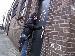 Deep-throating a cock through a glory hole after toying with her cooch Deep-throating a cock through a glory hole after toying with her cooch