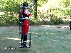 latex restrain bondage doll jewell encaged and stored in silo