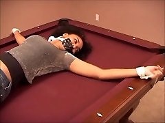 Sabrina tied to a pool table