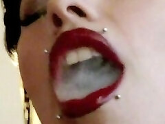 Pierced goth smoker oral stimulation