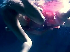 Two hot lezzies underwater touching eachother