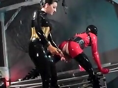 Woman pounds a man in latex