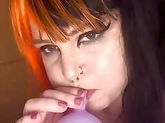 Goth nymph blows up balloons Goth nymph blows up balloons