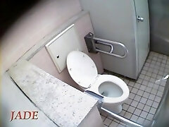 Schoolgirl talks to her beau and masturbates on toilet spy cam